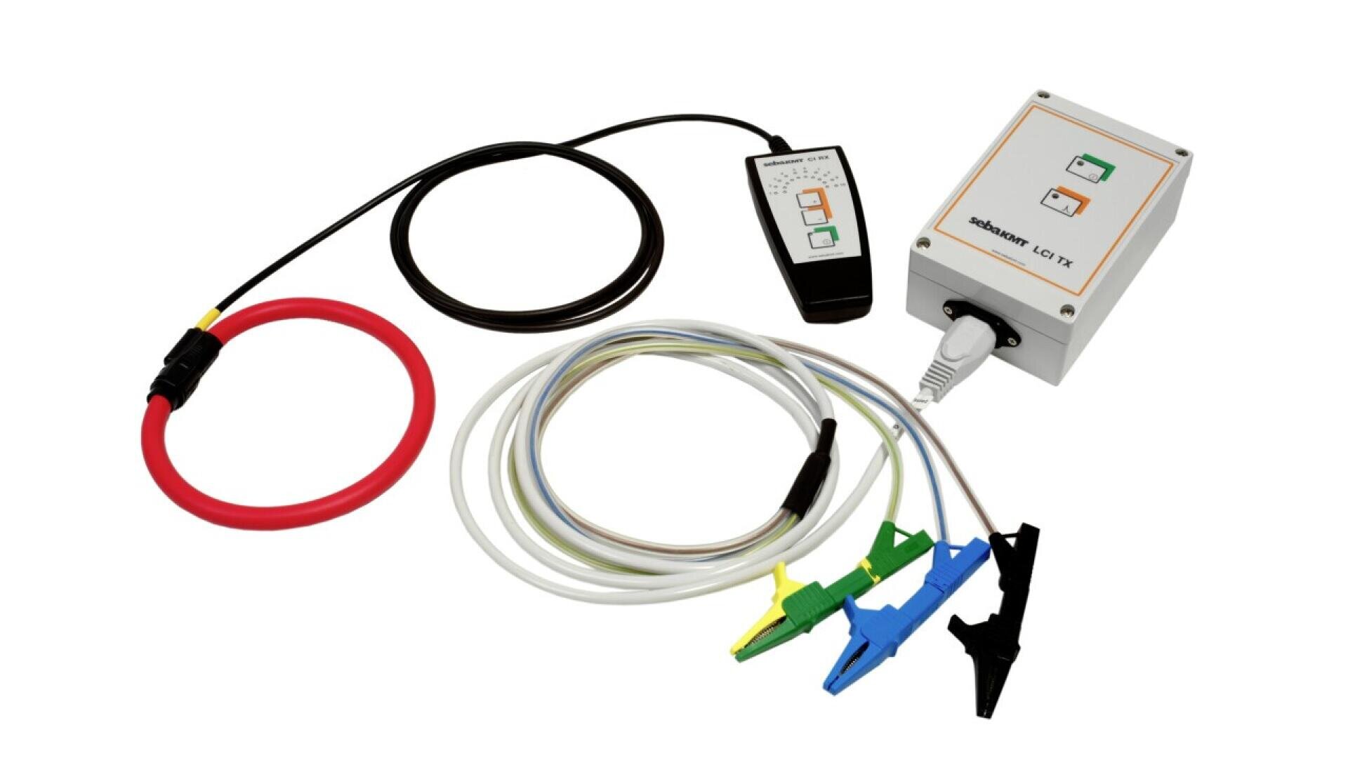 A set of electronic testing equipment, including a white control box, a black cable with a ring sensor, a handheld display, and colored alligator clips attached to wires, arranged on a white background.