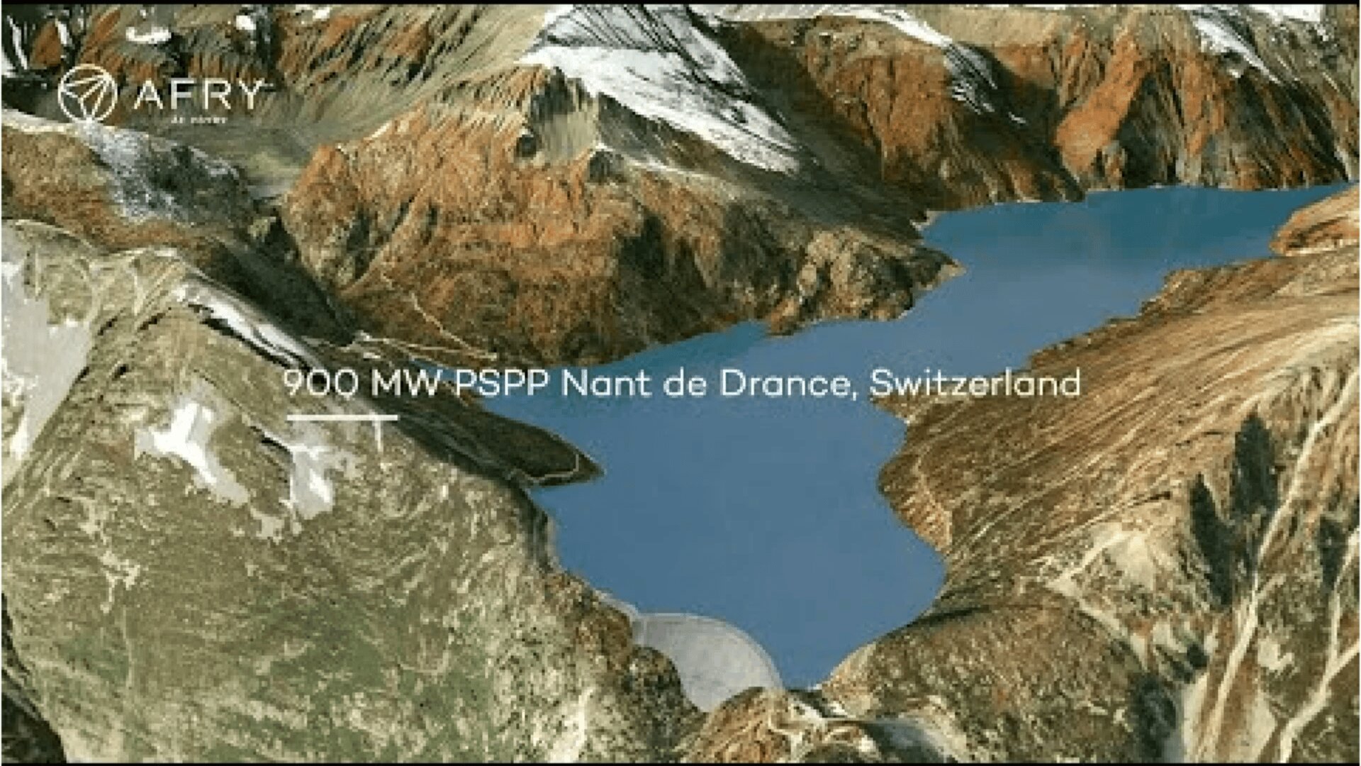 Aerial view of a blue reservoir surrounded by rocky, snow-capped mountains, labeled 900 MW-PSPP Nant de Drance, Switzerland with the AFRY logo in the corner.