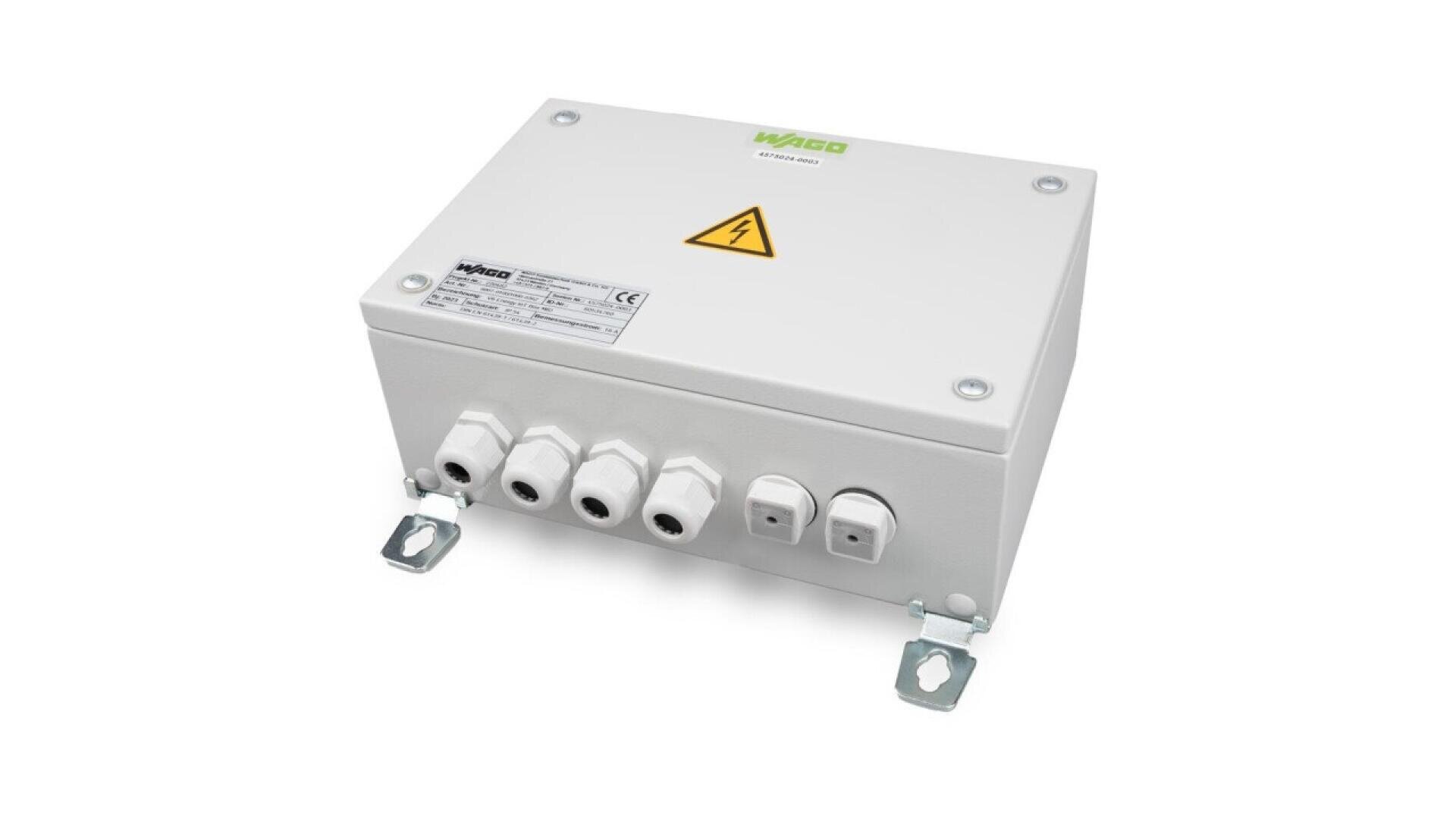 A white electrical junction box with the WAGO logo, a yellow high voltage warning symbol, connection ports at the front, and two mounting brackets at the base, viewed from a slight angle.