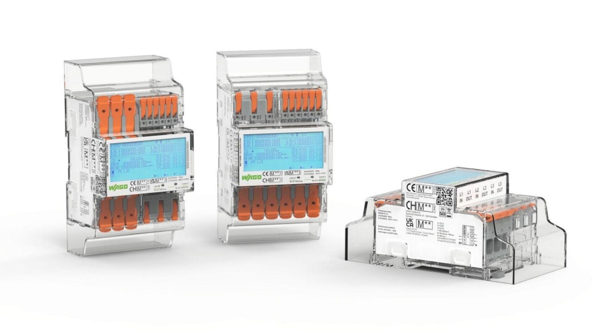 Three transparent electrical terminal blocks with orange levers and blue wiring diagrams on the front, displayed on a white background. One is shown lying on its side; the others stand upright.
