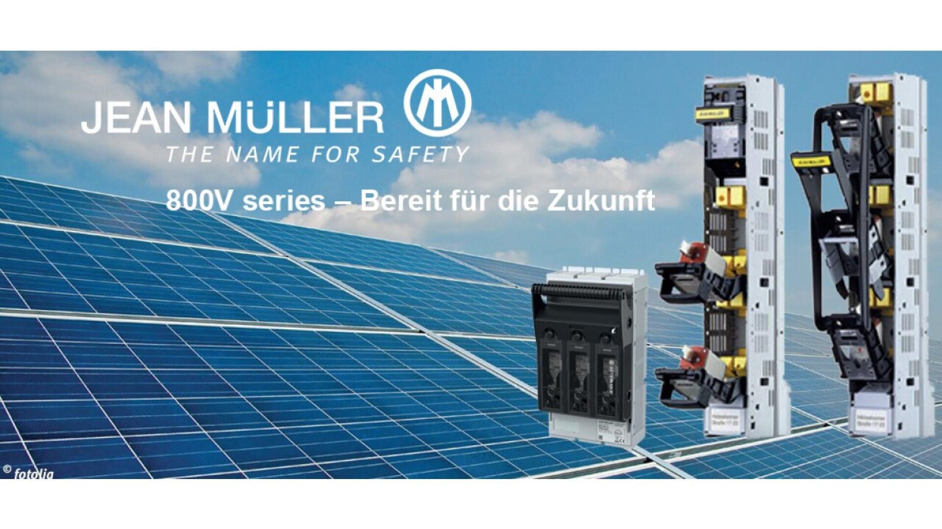 Solar panels under a blue sky with three electrical switchgear units displayed. Text reads: JEAN MÜLLER THE NAME FOR SAFETY. 800V series – Bereit für die Zukunft.