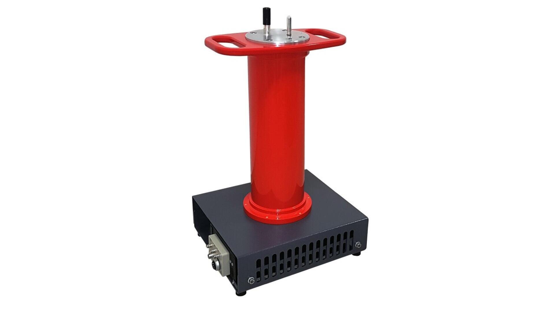 A red cylindrical electrical device with handles on top, mounted on a black rectangular base with ventilation slots and a connector on the side.