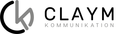 Logo with a stylized lowercase k in grey, followed by the word COMMUNICATION in large grey letters on a transparent background.