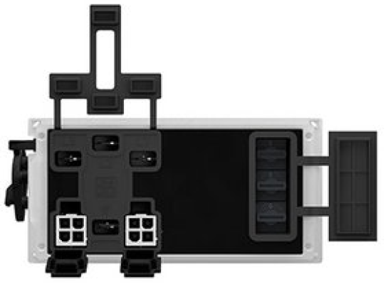 Ein schwarz-weißes elektronisches Gerät, von oben betrachtet, mit mehreren Steckdosen, Anschlüssen und Schaltern. Das Gerät hat hervorstehende Komponenten an der oberen und rechten Seite.